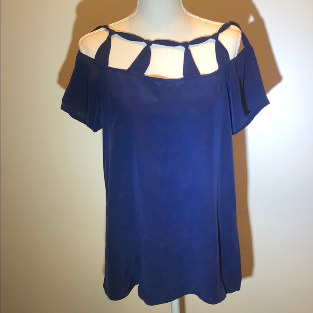 Silk top with cutout detail around neckline